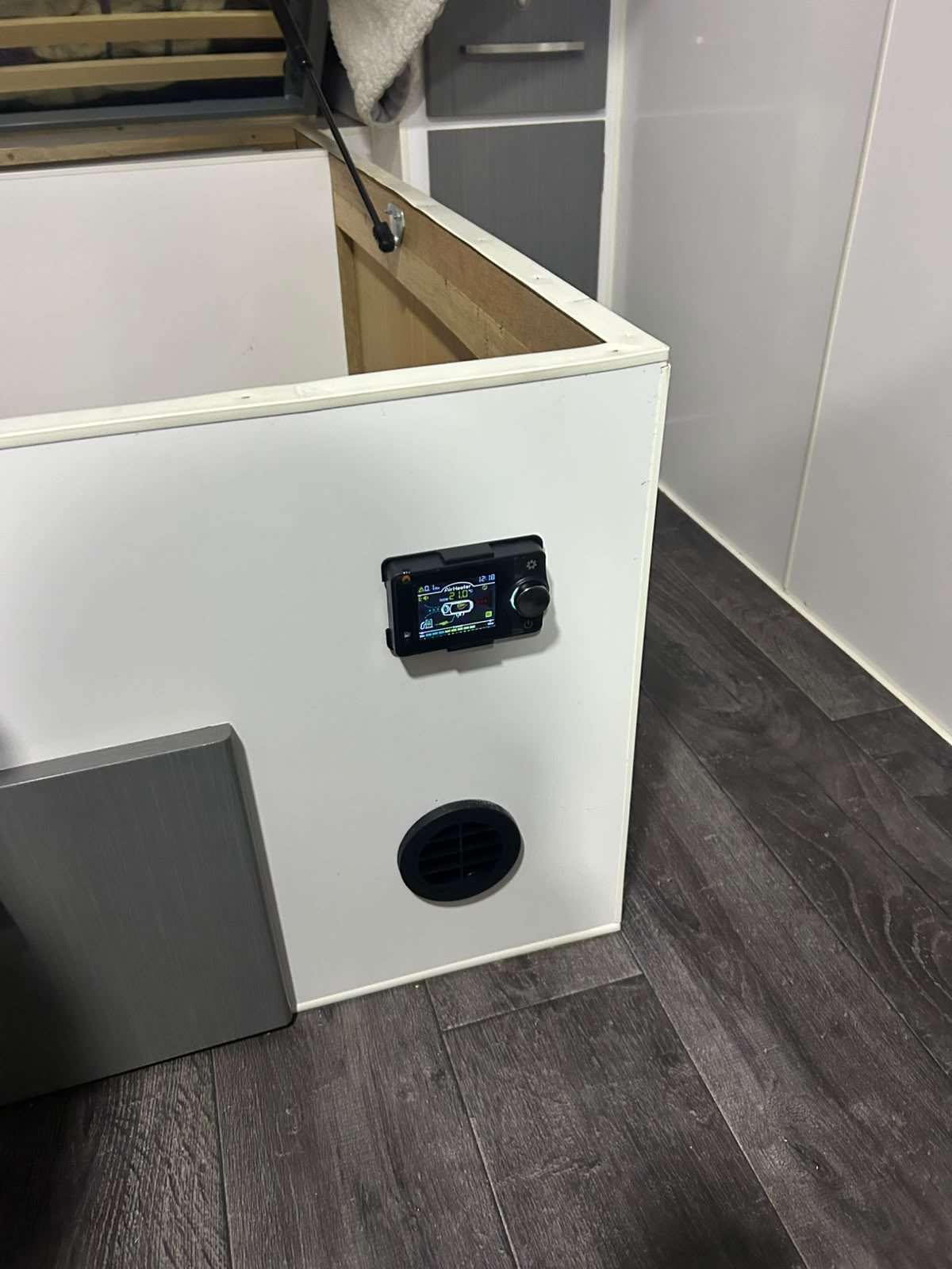 Born to Roam diesel heater digital controller and floor vent installed in a caravan bed base by G&S Caravan Services in Port Stephens