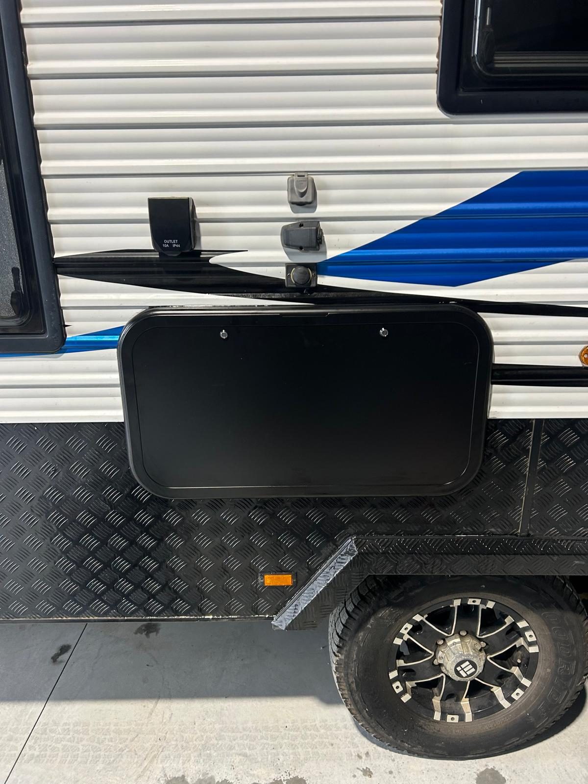 External Born to Roam diesel heater exhaust and fuel filler hatch fitted to a caravan sidewall by G&S Caravan Services in Port Stephens