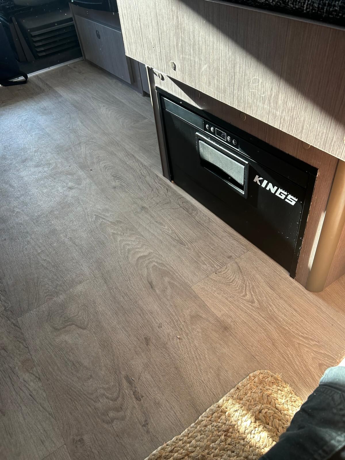 Completed caravan fridge installation with tidy wiring and secure mounting by G&S Caravan Services