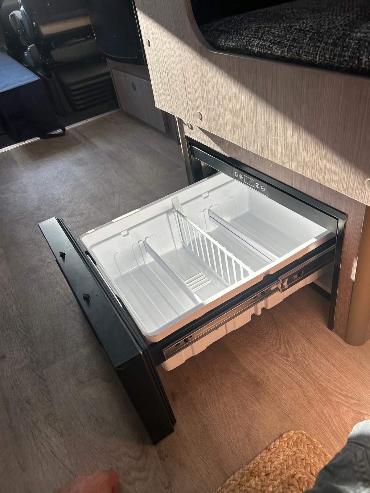 Detail of caravan fridge install showing 12V wiring loom and fuse connections by G&S Caravan Services
